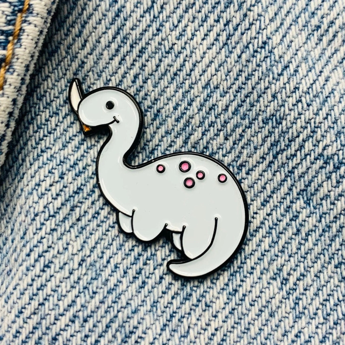 Dinosaur with knife Enamel Pin