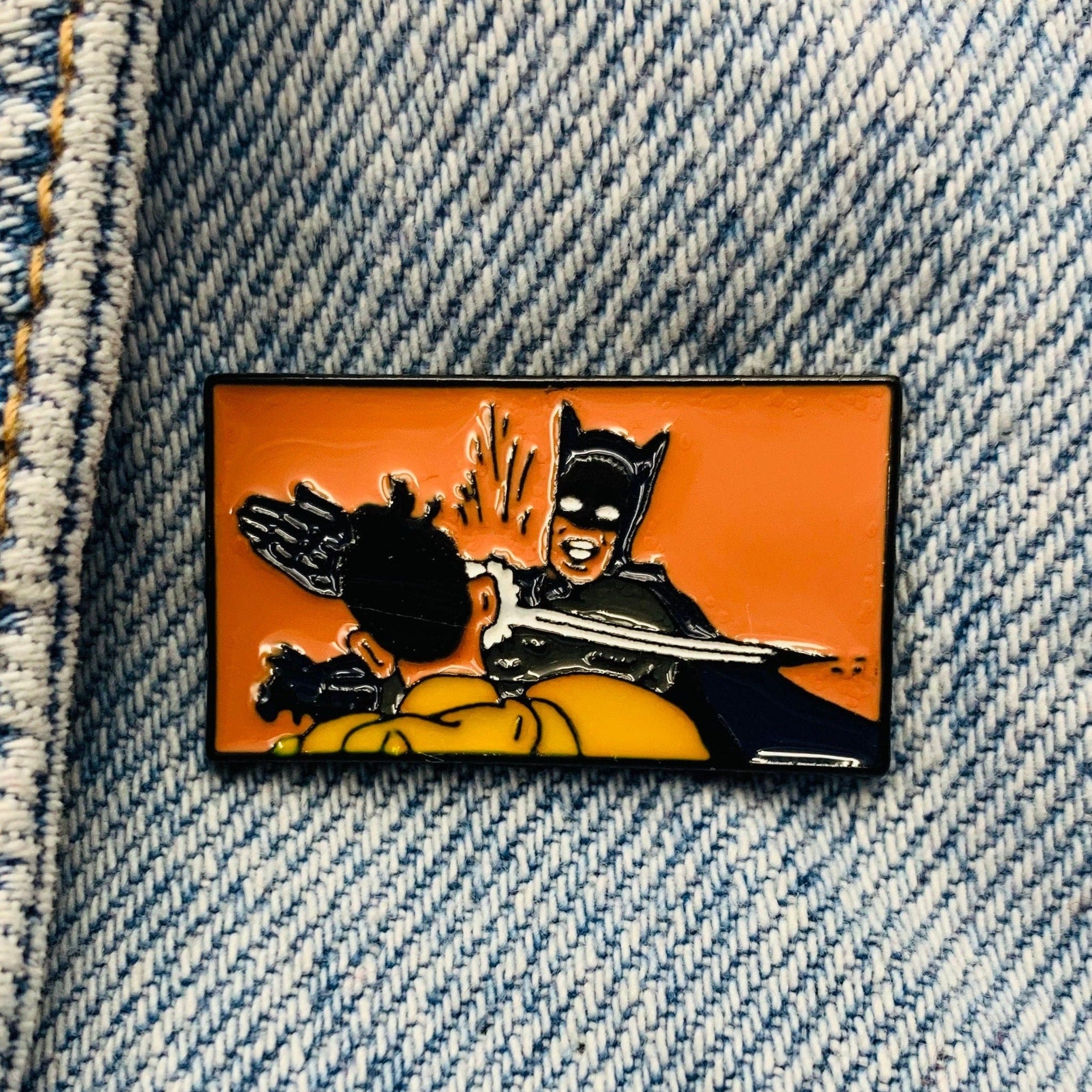 Batman slapping Robin Enamel Pin